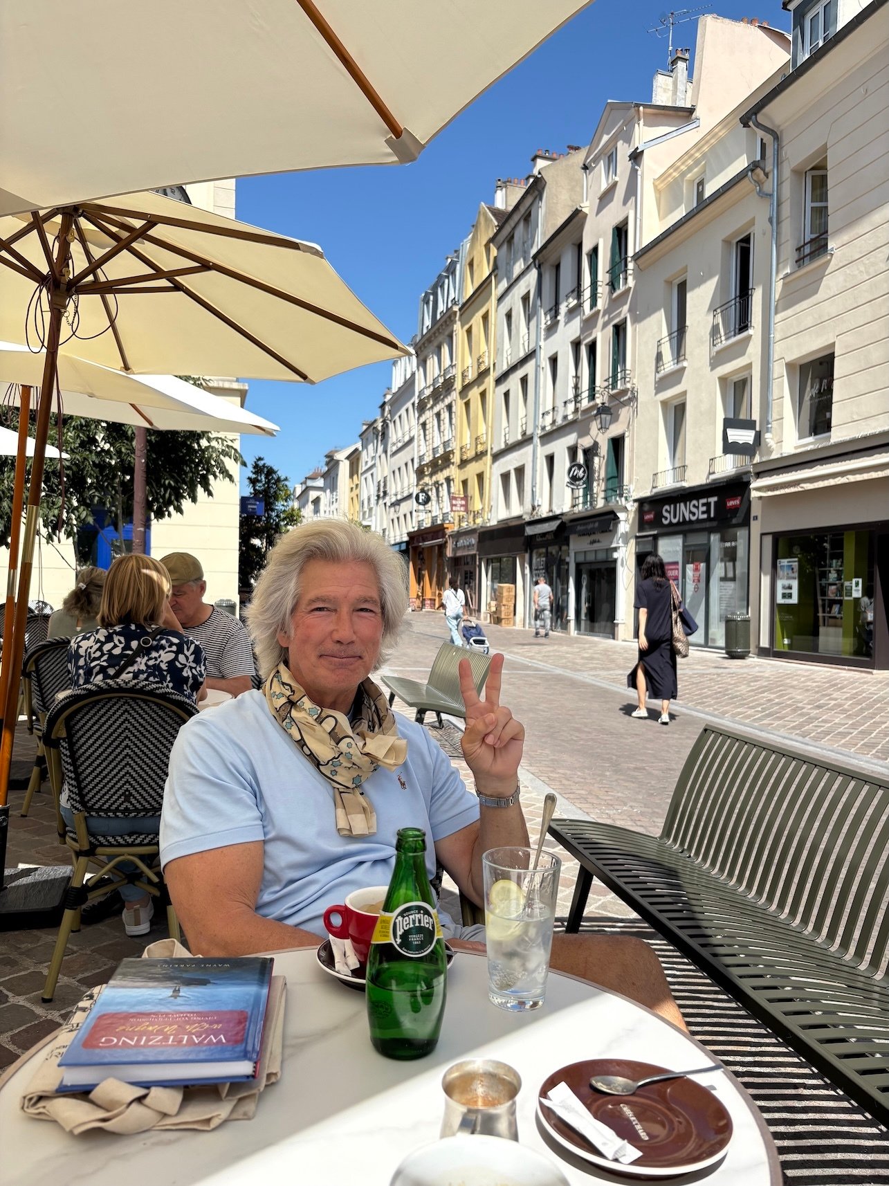 Wayne at cafe with book